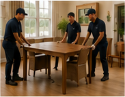White-glove professionals placing a dining table in the requested location